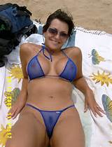 Tanned Brunette Milf in Sunglasses and a Sheer Blue Micro Bikini ...