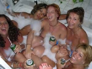 These college girls and one milf are all together in the hot tub naked ...