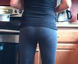 MILF cooking in gray yoga pants