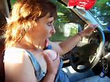 Topless Milf Driving Car While Licking Breast