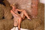 Blonde milf gets comfortable in lingerie while in the barn