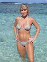 blonde beach milf in a sheer powder blue bikini