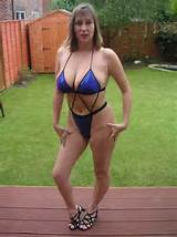 ... sex-partners.com big tits British milf in bikini posing in her garden