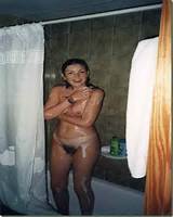 Cute Milf caught off guard in the shower with her unshaven pussy.